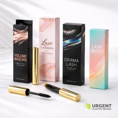 4 mascara boxes with black and gold wands displayed on a white surface