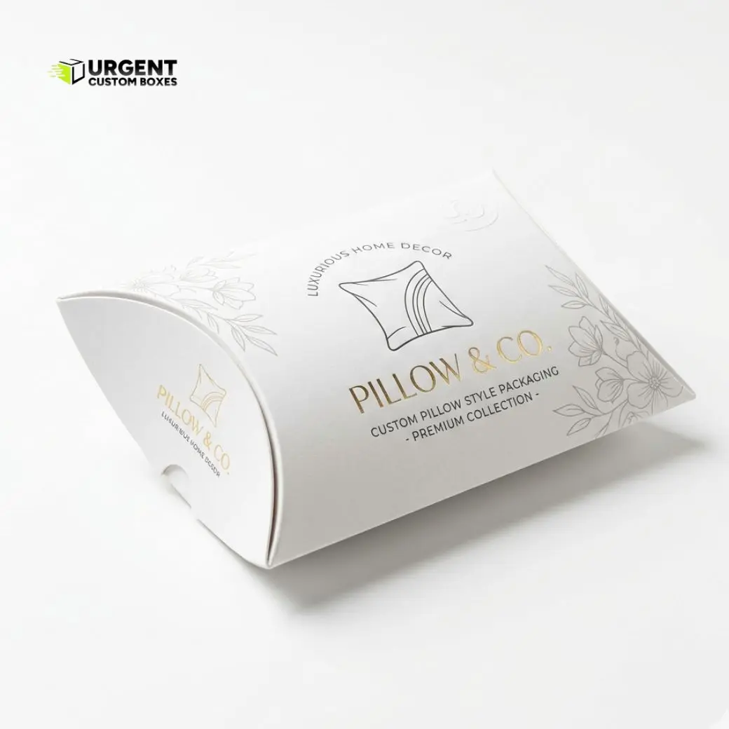 Custom pillow style packaging in premium white cardstock with elegant gold foil branding and fine line floral illustrations