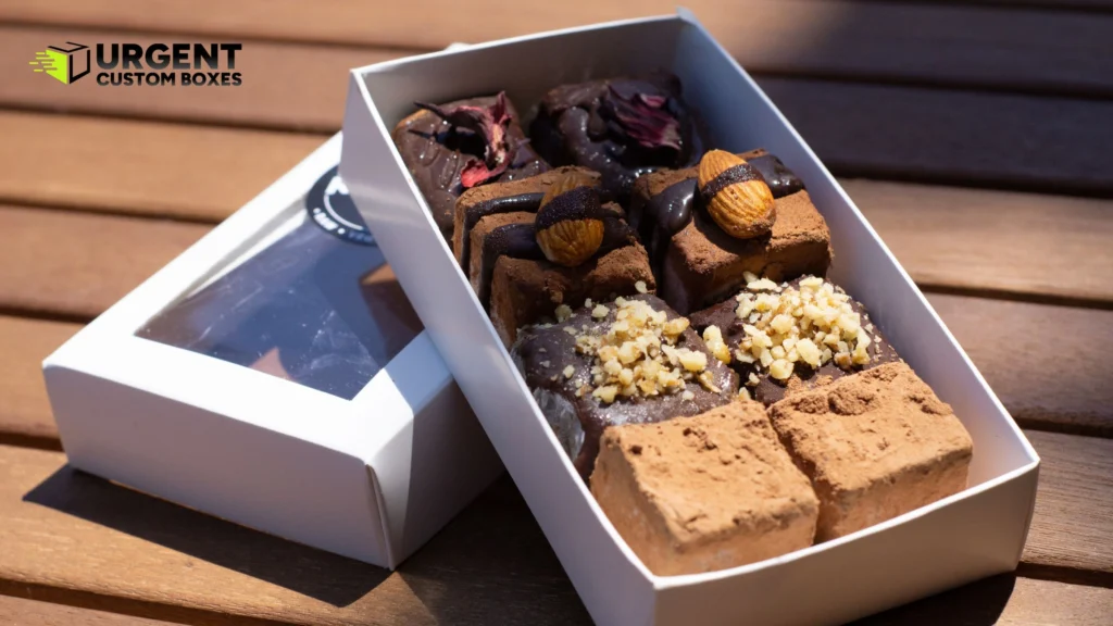 Gourmet chocolate truffles and brownies arranged in a white window box
