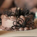 Frosted cake sized for its cake box and board