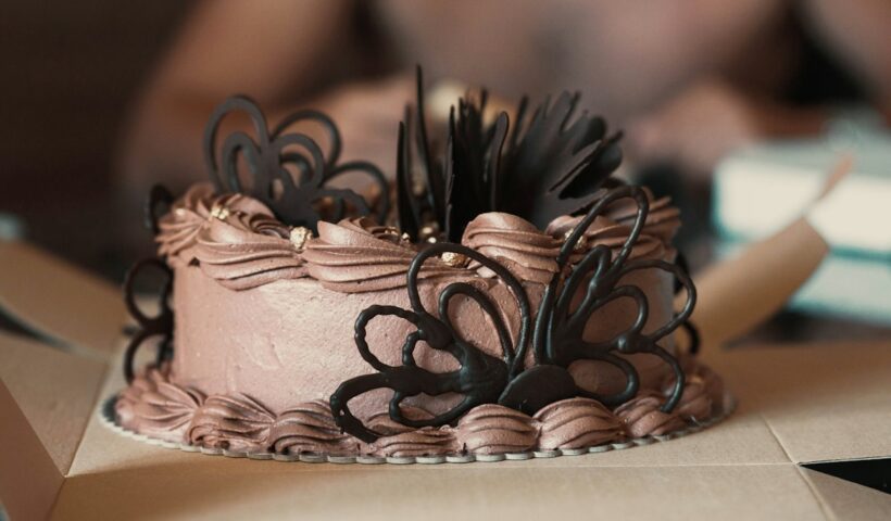 Frosted cake sized for its cake box and board
