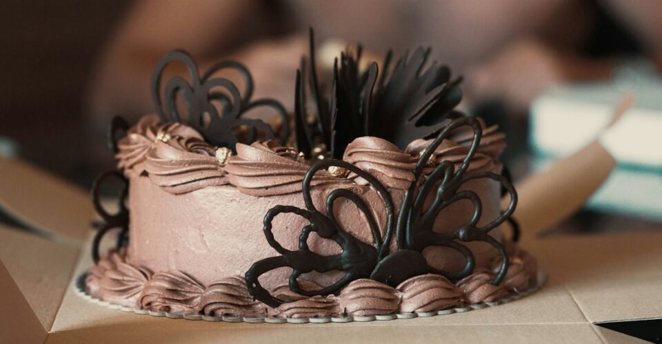 Frosted cake sized for its cake box and board