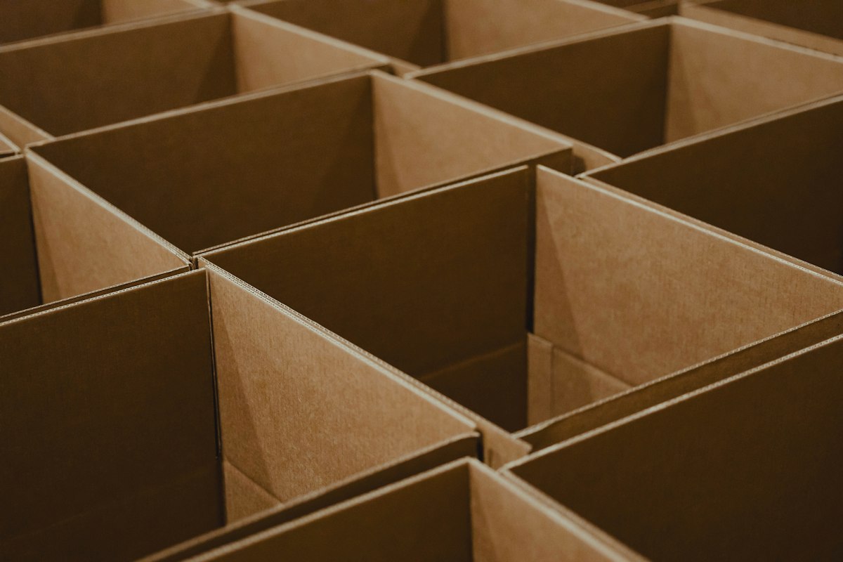 Corrugated shipping boxes used as outer cartons for box in box cookie packing